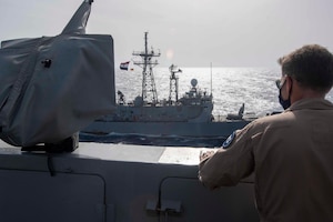 210314-N-JC800-1400 RED SEA (March 14, 2021) – U.S. Navy Capt. Dave Kurtz, commanding officer of amphibious transport dock ship USS Somerset (LPD 25), observes Egyptian guided-missile frigate ENS Sharm El Sheikh (FFG 901) during a passing exercise in the Red Sea, March 14. Somerset, part of the Makin island Amphibious Ready Group, and the 15th Marine Expeditionary Unit are deployed to the U.S. 5th Fleet area of operations in support of naval operations to ensure maritime stability and security in the Central Region, connecting the Mediterranean and Pacific through the western Indian Ocean and three strategic choke points. (U.S. Navy photo by Mass Communication Specialist 2nd Class Heath Zeigler)