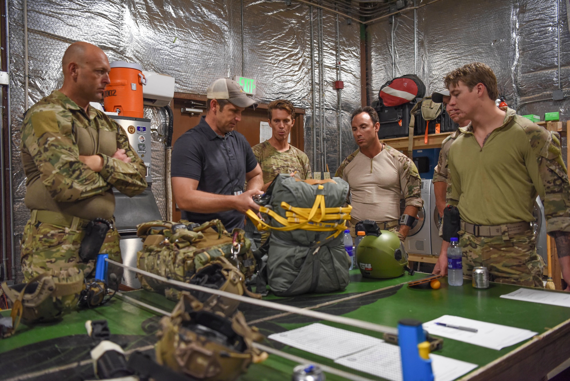 Members of the 82nd Expeditionary Rescue Squadron prepare to do a prejump brief at Camp Lemonnier, Djibouti, March 16, 2021.