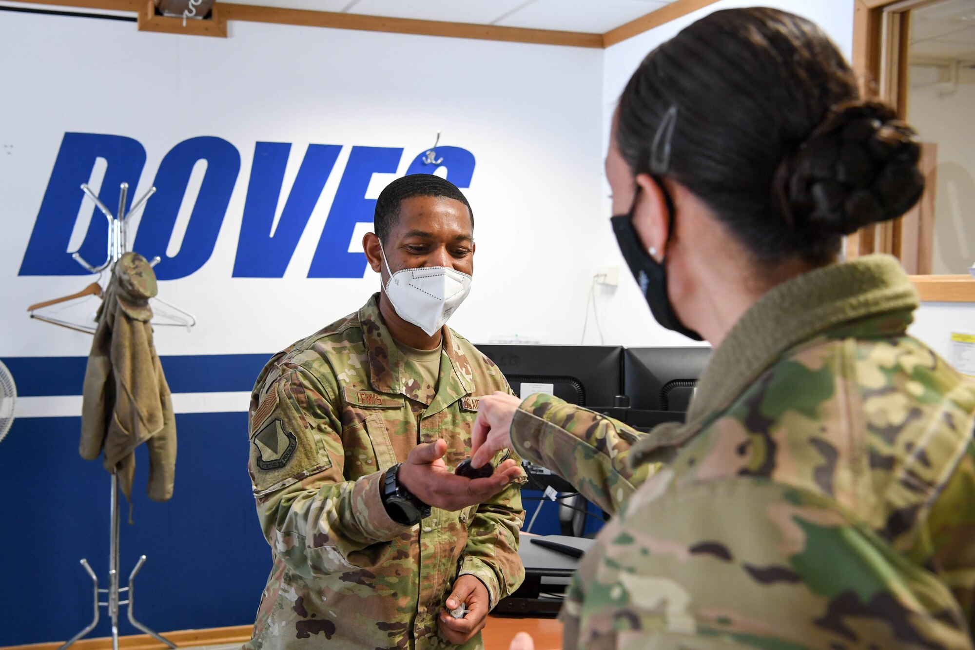 An Airman receives a coin