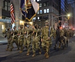 Soldiers of the New York Army National Guard's 1st Battalion, 69th Infantry, step off for an abbreviated version of the annual St. Patrick's Day Parade accompanied by Irish Wolfhounds, the traditional mascot of the regiment, in New York March 17, 2021. The regiment has led the parade annually since 1851.