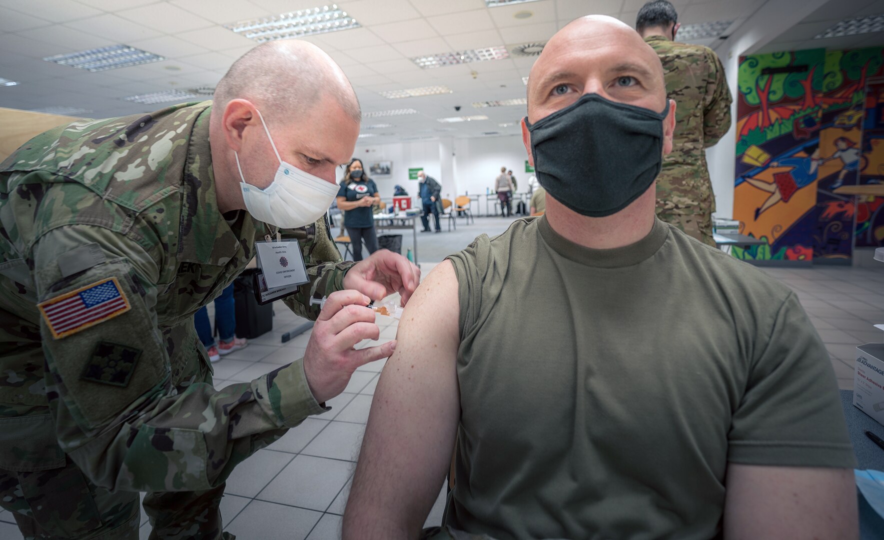 A U.S. Army Soldier from 1st Battalion, 214th Aviation Regiment, 12th Combat Aviation Brigade, receives his second and final COVID-19 vaccine dose Feb. 24 in Wiesbaden, Germany.
