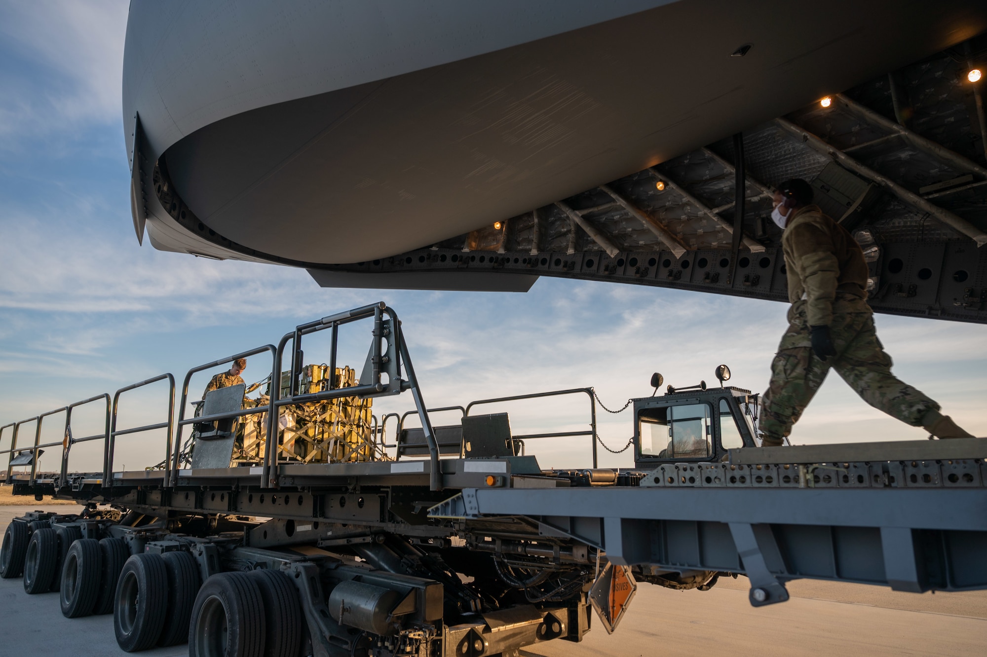 Cargo specialists from the 436th Aerial Port Squadron prepare to load cargo onto a Royal Australian Air Force C-17 Globemaster III at Dover Air Force Base, Delaware, March 13, 2021. The U.S. and Australia maintain a robust relationship underpinned by shared democratic values, common interests and cultural bonds. The U.S.-Australia alliance is an anchor for peace and stability in the Indo-Pacific region and around the world. (U.S. Air Force photo by Airman 1st Class Faith Schaefer)