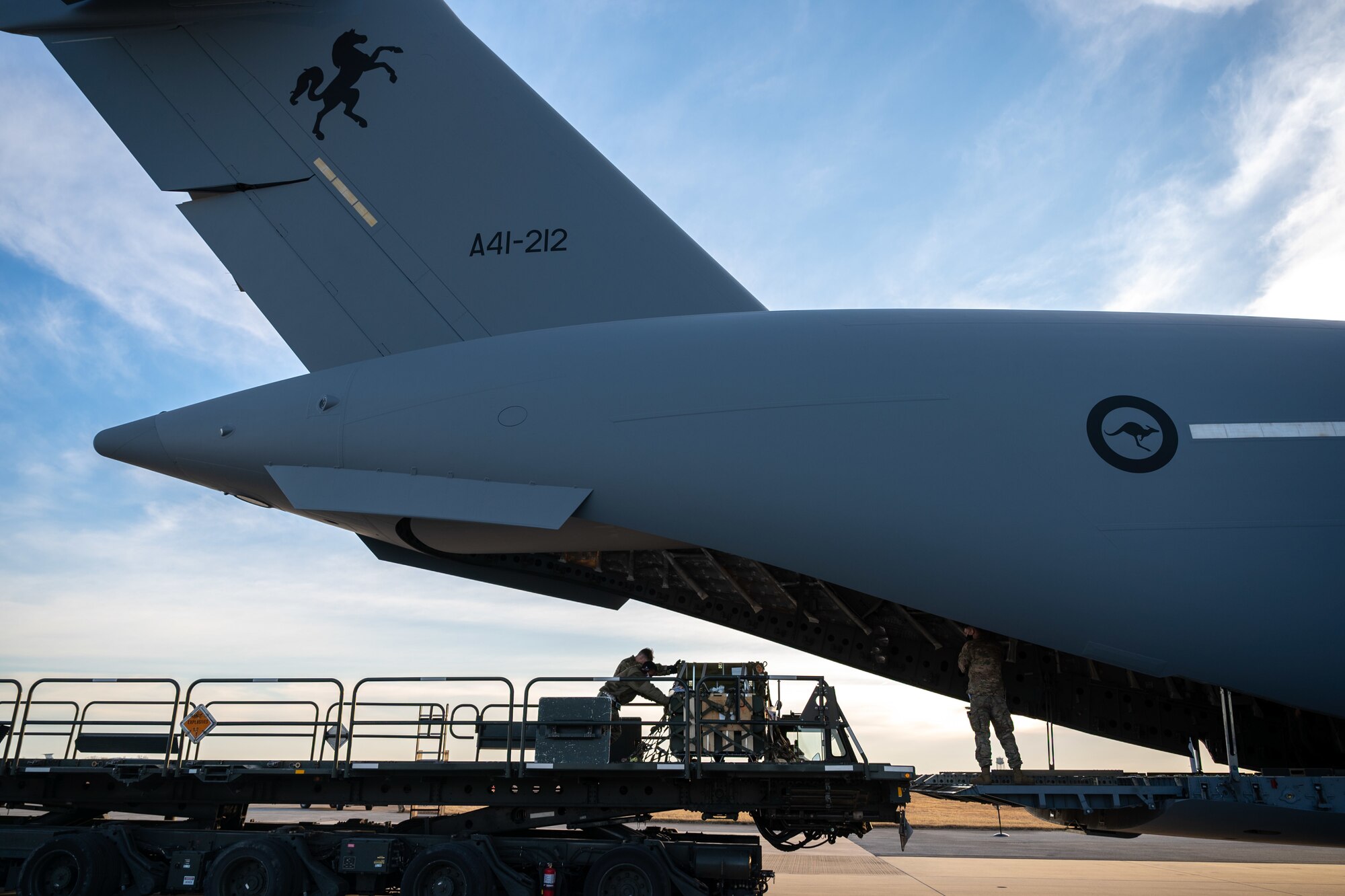 Cargo specialists from the 436th Aerial Port Squadron load cargo onto a Royal Australian Air Force C-17 Globemaster III at Dover Air Force Base, Delaware, March 13, 2021. The U.S. and Australia maintain a robust relationship underpinned by shared democratic values, common interests and cultural bonds. The U.S.-Australia alliance is an anchor for peace and stability in the Indo-Pacific region and around the world. (U.S. Air Force photo by Airman 1st Class Faith Schaefer)