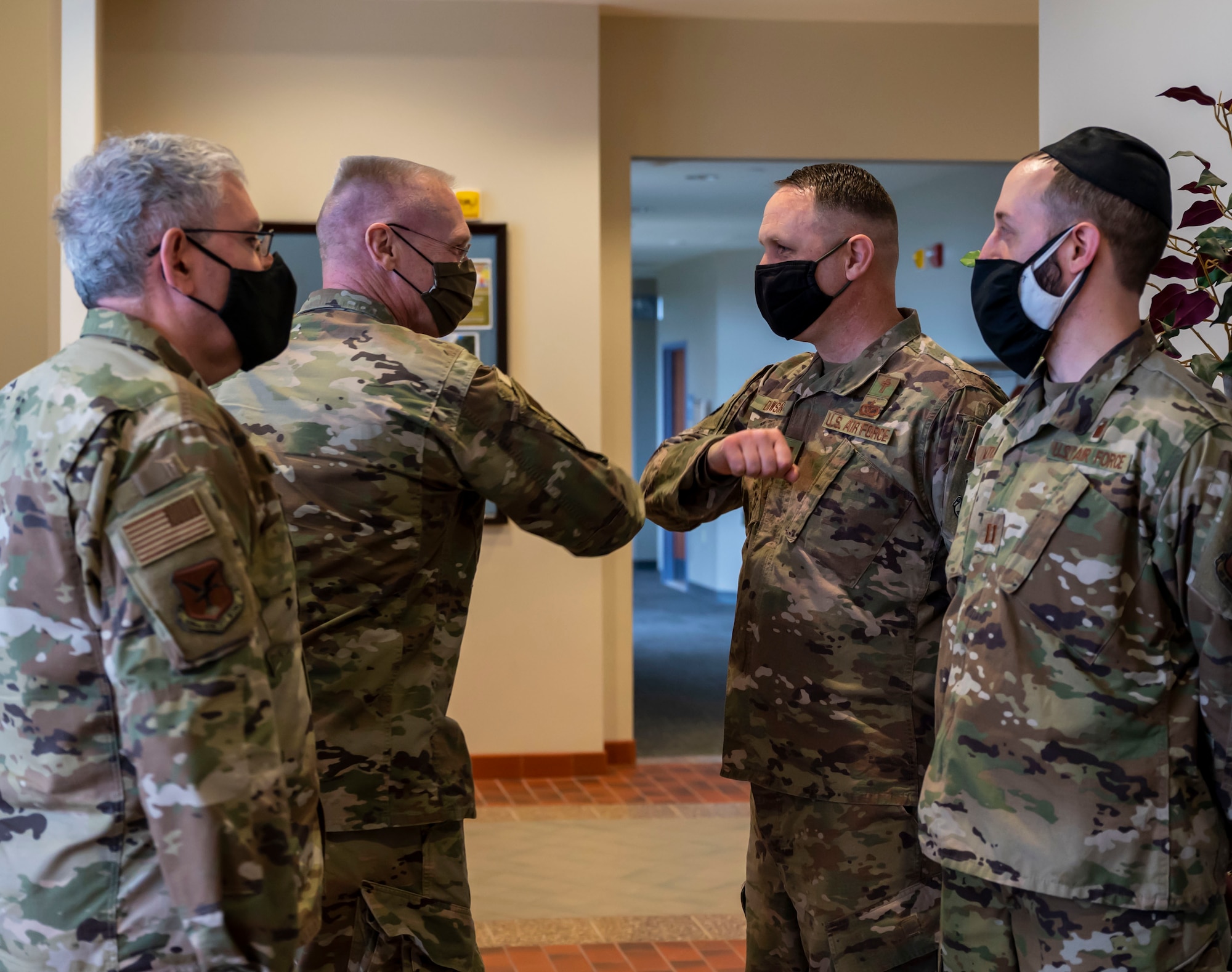 Col. James Brantingham, Air Mobility Command command chaplain, left, greets Capt. Jonathan Dawson, 436th Airlift Wing chaplain, at the base chapel on Dover Air Force Base, Delaware, March 16, 2021. The Air Force Chaplain Corps provides spiritual care and the opportunity for Airmen, their families and other authorized personnel to exercise their constitutional right to the free exercise of religion. (U.S. Air Force photo by Airman 1st Class Cydney Lee)