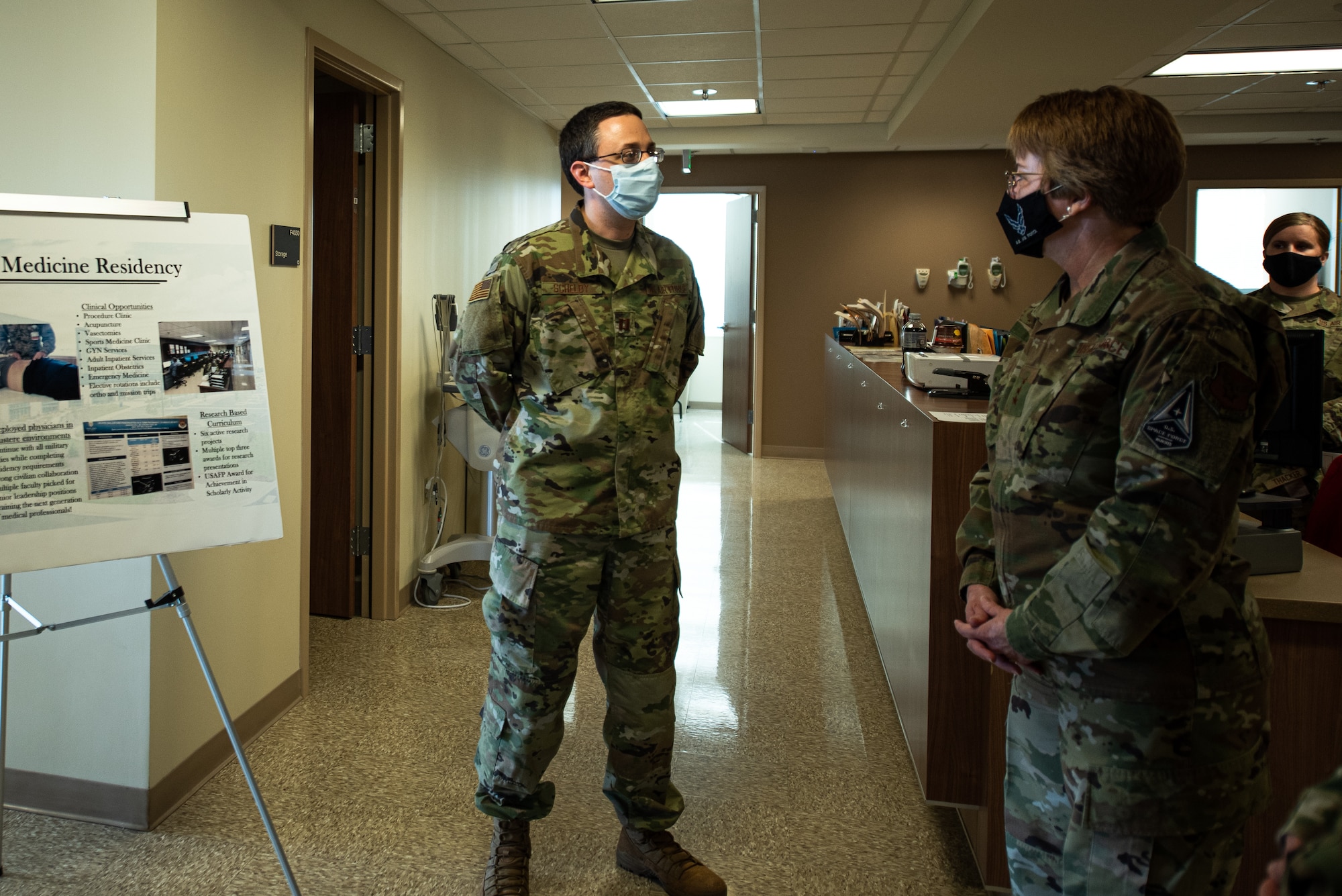 Two Airmen are briefed.