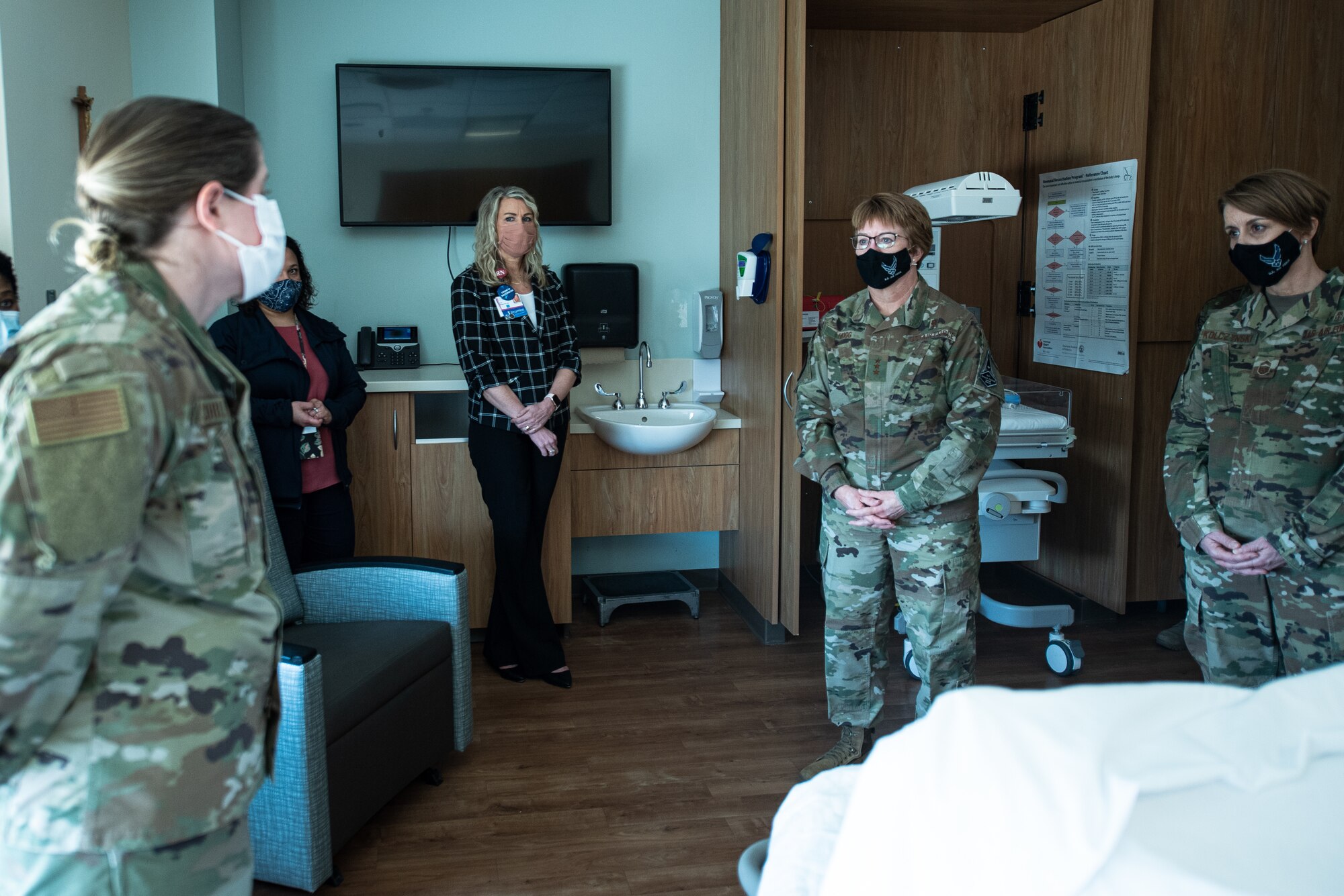 Three Airmen are briefed.