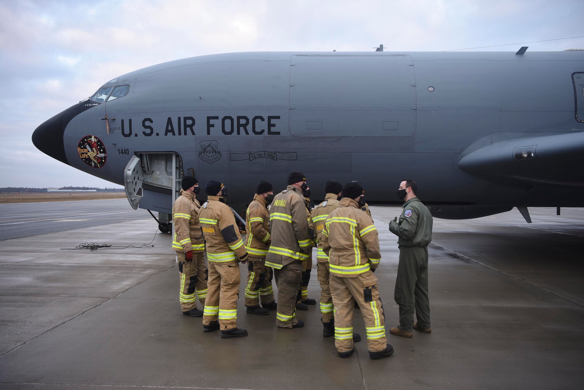 U.S. Air Force Tech. Sgt. Michael Dunn, 351st Air Refueling Squadron boom operator, speaks to a group of Estonian firefighters about the KC-135 Stratotanker aircraft during exercise Baltic Trident at Ämari Air Base, Estonia, March 17, 2021. Training with joint and combined allies and partners during agile combat employment events increases lethality and enhances interoperability, allowing forces to counter military aggression and coercion by sharing responsibilities for common defense. (U.S. Air Force photo by Senior Airman Joseph Barron)