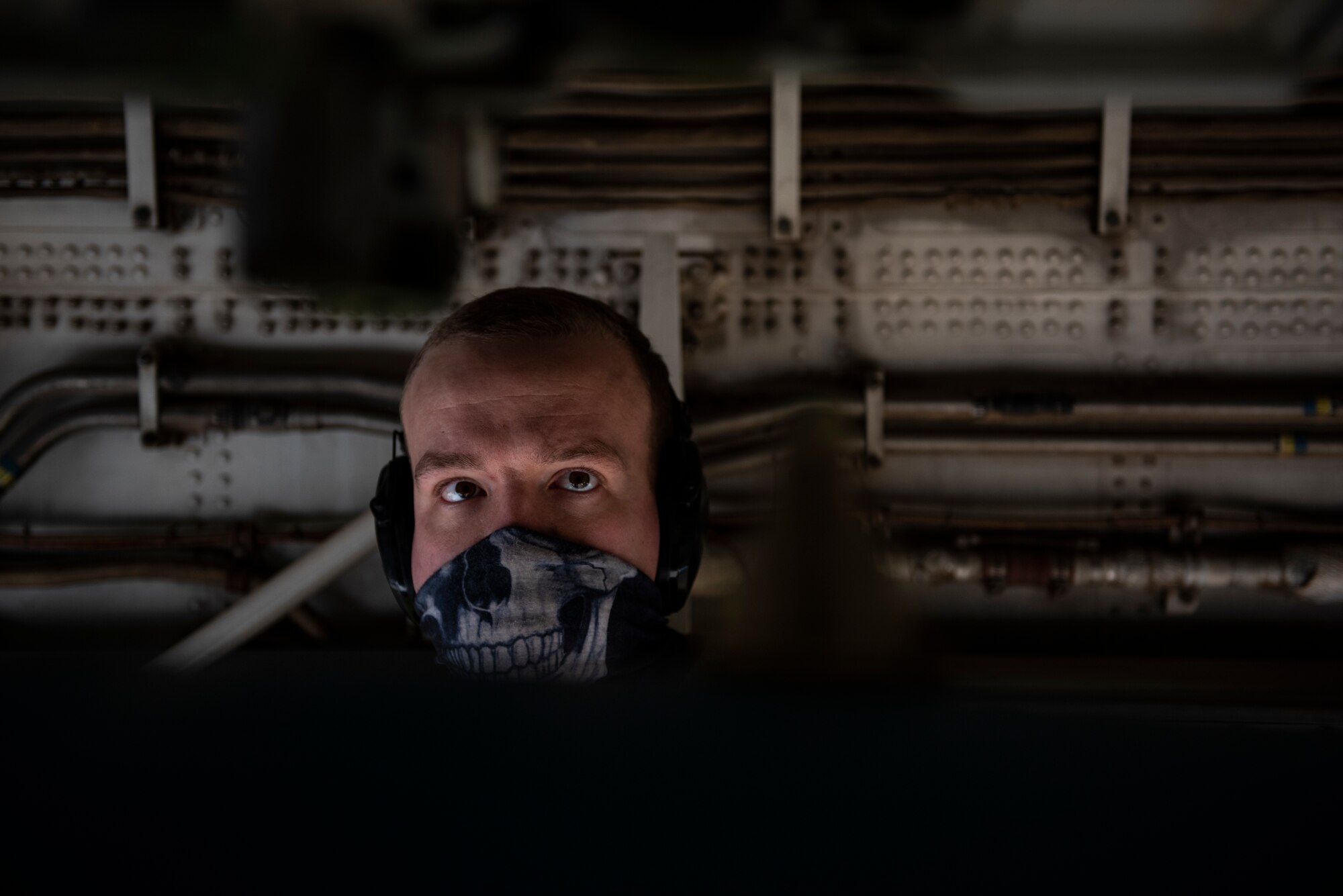 A weapons load crew member assigned to the 9th Expeditionary Bomb Squadron observes as a bomb dummy unit is loaded into the bomb-bay of a B-1B Lancer at Ørland Air Force Station, Norway, March 13, 2021. The multi-mission B-1B can rapidly deliver massive quantities of precision and non-precision munitions against any adversary, anywhere in the world at any time.  (U.S. Air Force photo by Airman 1st Class Colin Hollowell)