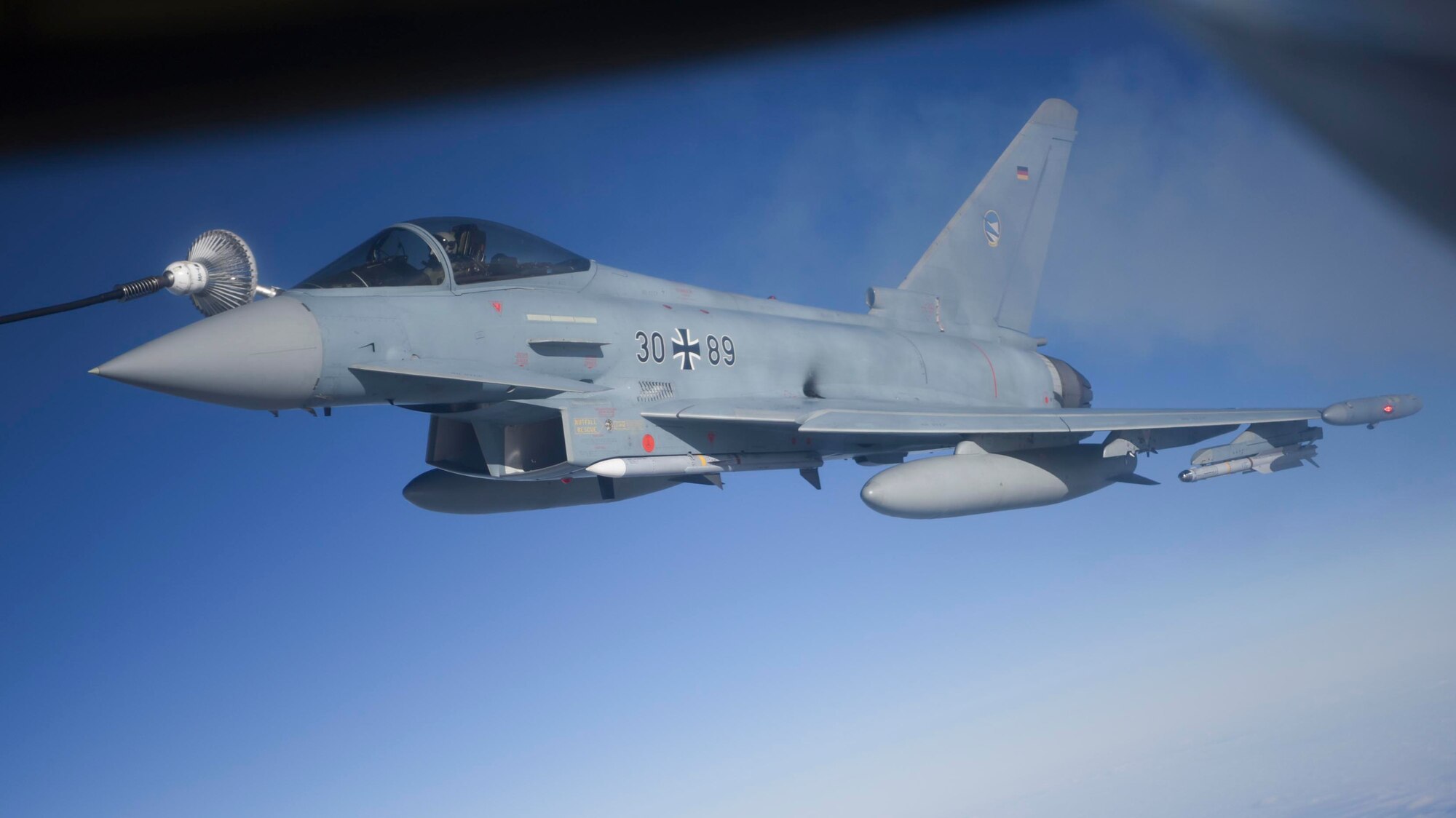 A German air force EF-2000 Typhoon aircraft receives fuel from a U.S. Air Force KC-135 Stratotanker aircraft assigned to the 100th Air Refueling Wing over Estonia during exercise Baltic Trident, March 16, 2021. Continuously strengthening alliances and partnerships creates a networked security architecture capable of deterring aggression and maintaining stability. (U.S. Air Force photo by Senior Airman Joseph Barron)
