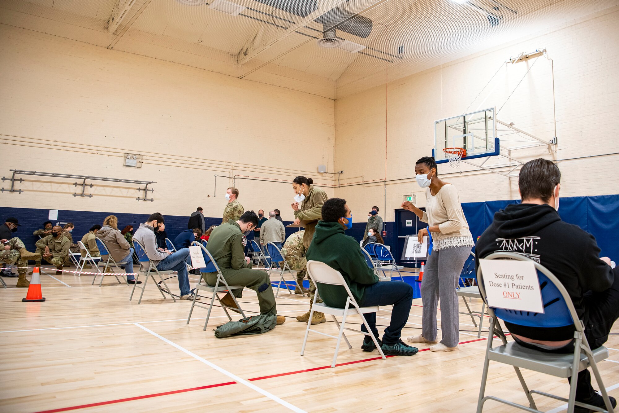 The 501st Combat Support Wing conducts a COVID-19 Vaccination line, at RAF Alconbury, England, Mar. 18, 2021. This is the first time the 501st CSW has conducted a mass-vaccination line and are expected to vaccinate approximately 300 people. Multiple Airmen and civilians from the 423rd Medical, Civil Engineering, Emergency management and Communication squadrons assisted in helping vaccines be distributed to the pathfinder community. (U.S. Air Force photo by Senior Airman Eugene Oliver)