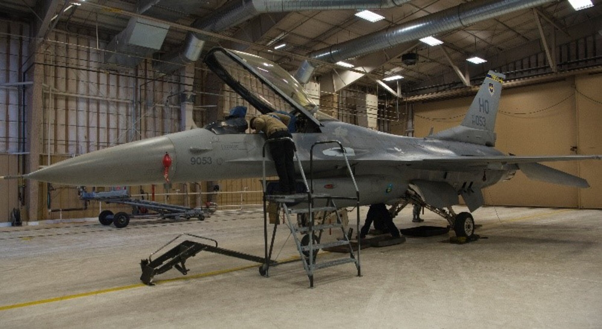 Members of the 849th Aircraft Maintenance Squadron work on the F-16 Viper Aircraft 9053, Feb. 23, 2021, on Holloman Air Force Base, New Mexico. The 849th AMXS spent 22 months rebuilding the aircraft to return it to operational status. (U.S. Air Force photo by Airman 1st Class Jessica Sanchez)