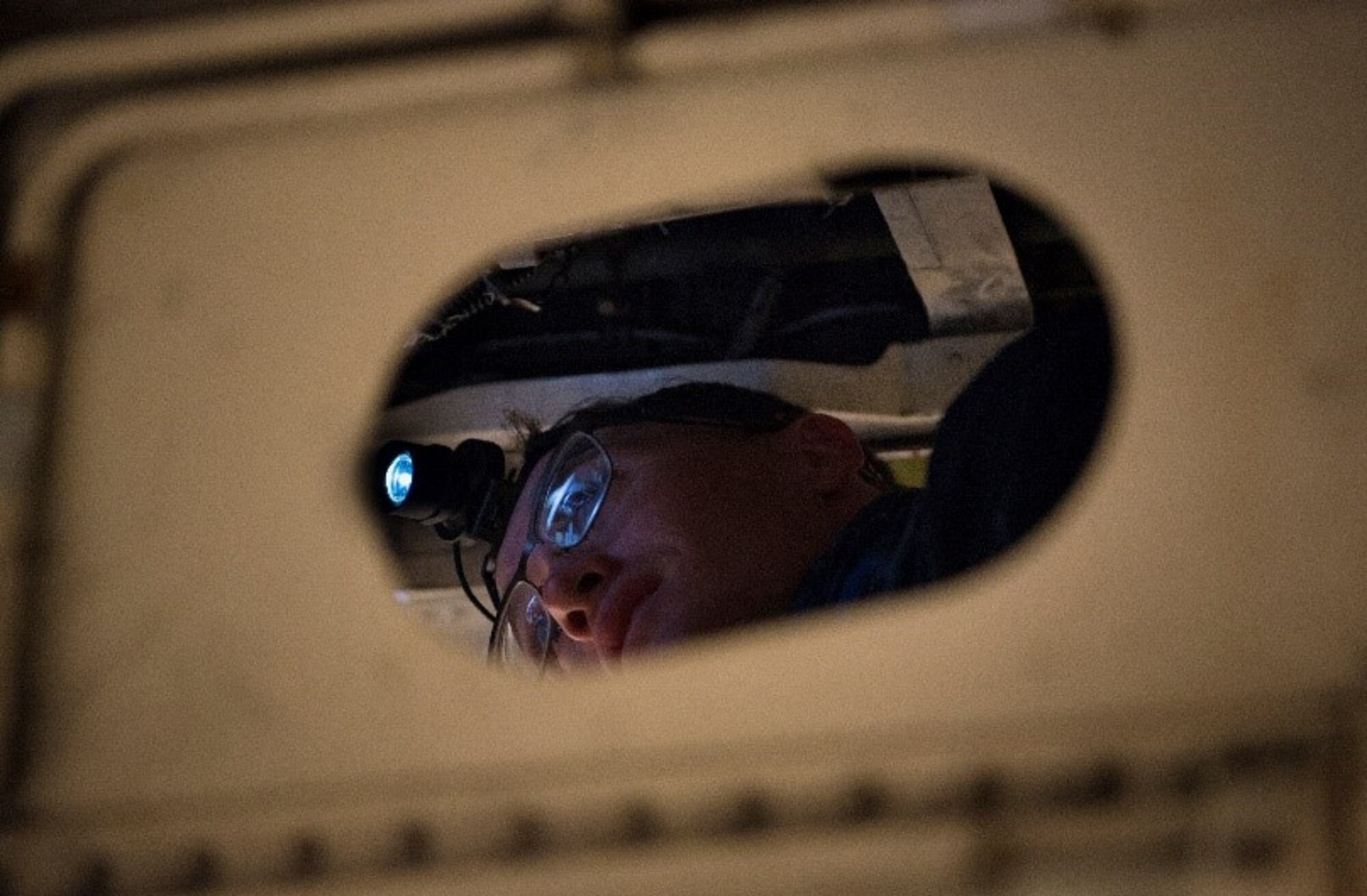 Staff Sgt. Bill Bohnas, 849th Aircraft Maintenance Squadron crew chief, tubes support brackets on hydraulic lines on an F-16 Viper, Feb. 23, 2021, on Holloman Air Force Base, New Mexico. The support brackets keep hydraulic lines from chaffing. (U.S. Air Force photo by Airman 1st Class Jessica Sanchez)