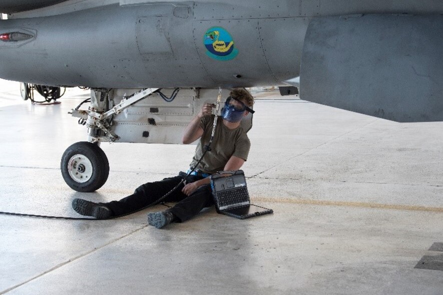 Senior Airman Brian Raatz, 849th Aircraft Maintenance Squadron crew chief completes preflight ground checks on F-16 Viper Aircraft 9053, March 2, 2021, on Holloman Air Force Base, New Mexico. Aircraft maintainers perform pre, post and between-flight safety and function checks, which includes double and triple checking fluid levels, landing gear and flight control functionality and running diagnostics on the electrical systems. (U.S. Air Force photo by Airman 1st Class Jessica Sanchez)