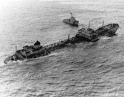 An aerial photo of the tanker Argo Merchant sinking off Nantucket Island in 1976.  USCGC Vigilant steams nearby.