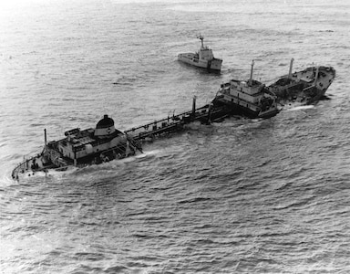 An aerial photo of the tanker Argo Merchant sinking off Nantucket Island in 1976.  USCGC Vigilant steams nearby.