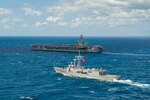 210317-N-MD713-1007 MEDITERRANEAN SEA (March 17, 2021) The Turkish frigate TCG Gemlik (F 492), front, sails alongside the Nimitz-class aircraft carrier USS Dwight D. Eisenhower (CVN 69), in the Mediterranean Sea, March 17, 2021. The IKE Carrier Strike Group is on a scheduled deployment in the U.S. Sixth Fleet area of operations in support of U.S. national interests and security in Europe and Africa. (U.S. Navy photo by Mass Communication Specialist 3rd Class Cameron Pinske/Released)