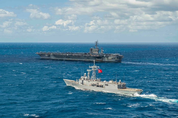 210317-N-MD713-1007 MEDITERRANEAN SEA (March 17, 2021) The Turkish frigate TCG Gemlik (F 492), front, sails alongside the Nimitz-class aircraft carrier USS Dwight D. Eisenhower (CVN 69), in the Mediterranean Sea, March 17, 2021. The IKE Carrier Strike Group is on a scheduled deployment in the U.S. Sixth Fleet area of operations in support of U.S. national interests and security in Europe and Africa. (U.S. Navy photo by Mass Communication Specialist 3rd Class Cameron Pinske/Released)