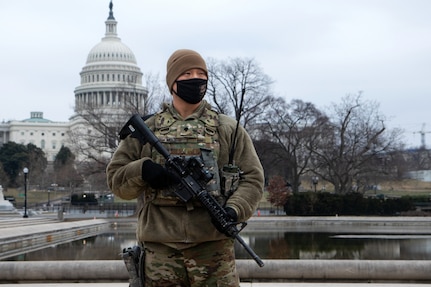 U.S. Army Spc. Kyle Moore with the 46th Military Police Company, 177th Military Police Brigade, Michigan National Guard, provides perimeter security near the U.S. Capitol in Washington, D.C., Feb. 12, 2021. The National Guard has been requested to continue supporting federal law enforcement agencies with security, communications, medical evacuation, logistics, and safety support to state, district and federal agencies through mid-March. (U.S. Army National Guard photo by Capt. Joe Legros)