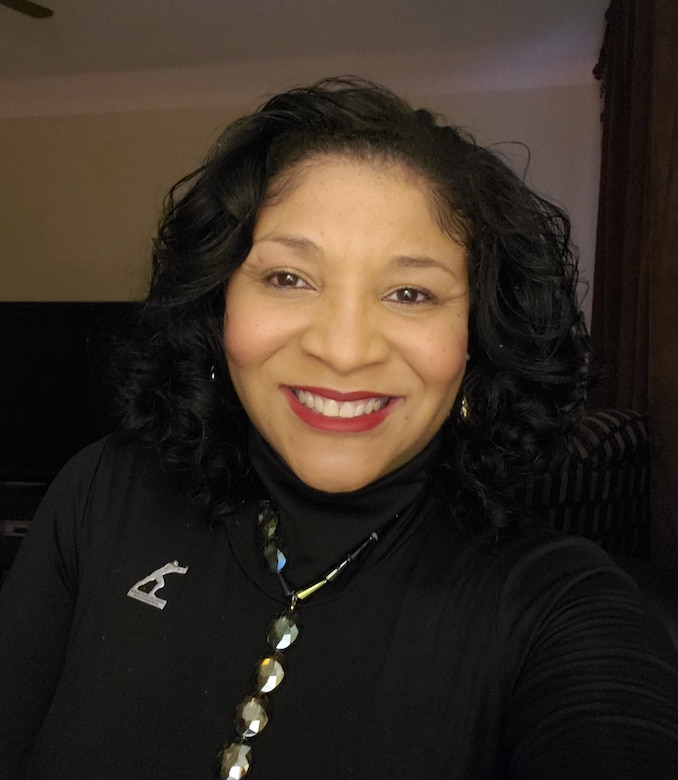 IN THE PHOTO, this month, we are highlighting Carla Wells. She is a government purchase card business manager for the Contracting/Oversight Branch. Here are a few photos of her during her time as a government purchase card business manager.
