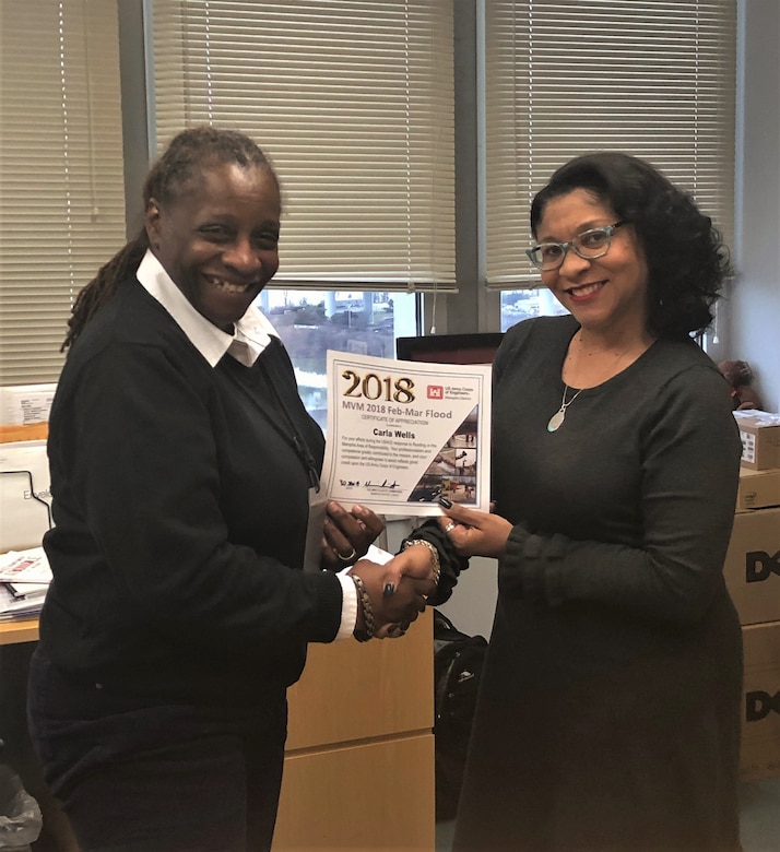 IN THE PHOTO, this month, we are highlighting Carla Wells. She is a government purchase card business manager for the Contracting/Oversight Branch. Here are a few photos of her during her time as a government purchase card business manager.