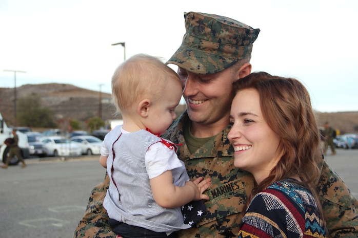 After a six-month deployment to Okinawa, Sgt. Christopher Lafriniere, a communications specialist with 3rd Battalion, 5th Marine Regiment, I Marine Expeditionary Force, greets his family at Marine Corps Base Camp Pendleton, Calif., Nov. 18, 2014. I MEF is continuously placing trained and equipped Marines in positions around the world, ready to respond to any emergency.