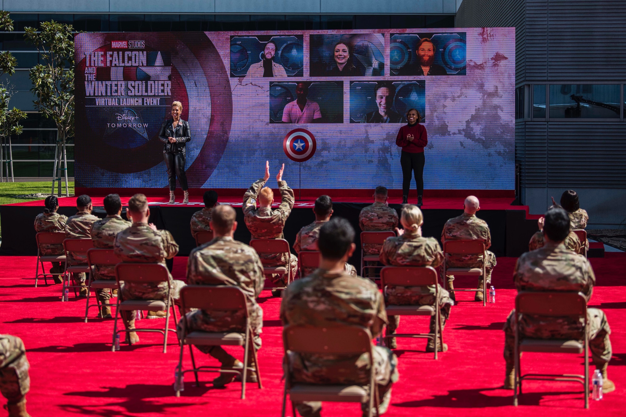 Members of the Space and Missile Systems Center and the 61st Air Base Group cheer on cast members during a question and answer segment of the Falcon and The Winter Soldier virtual launch event at Los Angeles Air Force Base, Calif., March 6, 2021. The cast - Anthony Mackie, Sebastian Stan, Emily VanCamp, Wyatt Russell and Daniel Brühl, answered questions about the show, shared behind-the-scenes facts and expressed their appreciation for support from the U.S. Air and Space Force during filming. (U.S. Space Force photo by Staff Sgt. Luke Kitterman)