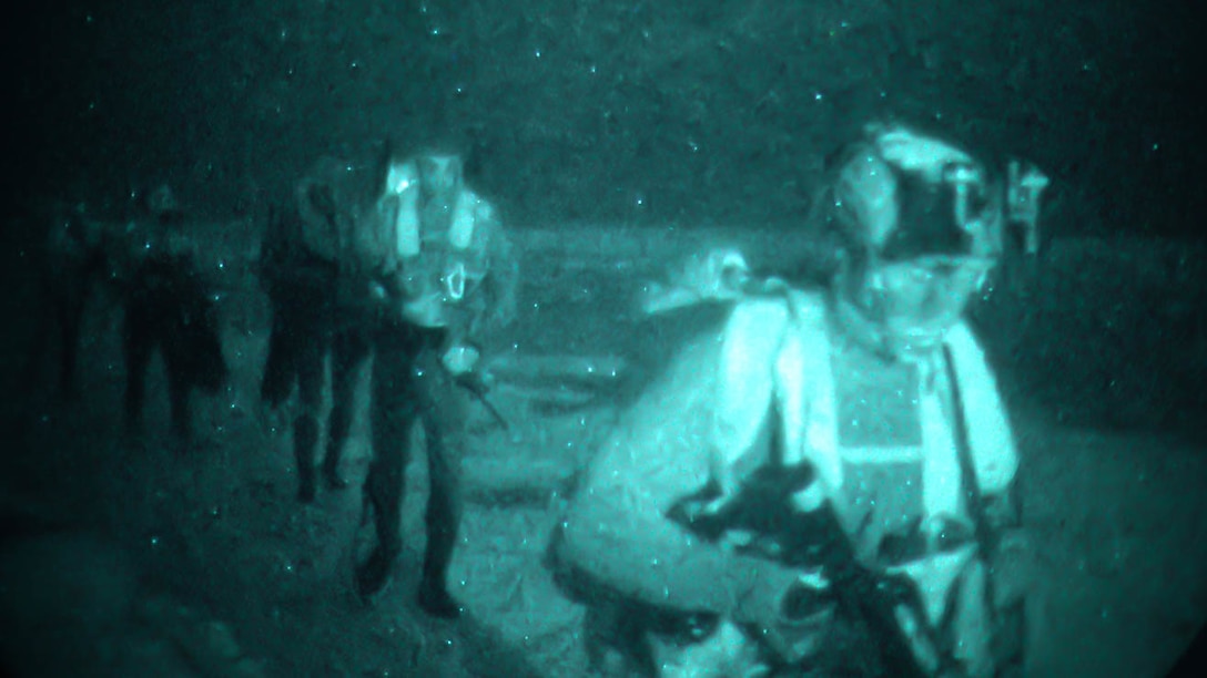 U.S. Marines with 3d Reconnaissance Battalion, 3d Marine Division and U.S. Army Soldiers with 1st Special Forces Group (Airborne) conduct an amphibious infiltration during Castaway 21.1 on Ie Shima, Okinawa, Japan, March 9, 2021. The exercise demonstrated the Marine Corps’ ability to integrate with the joint force to seize and defend key maritime terrain, provide low-signature sustainment, and execute long-range precision fires in support of naval operations from an expeditionary advanced base.