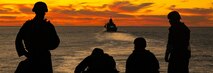 U.S. Marines and Sailors aboard the Wasp-class amphibious assault ship USS Essex (LHD-2) post security from the flight deck during exercise Steel Knight/Dawn Blitz (SK/DB) 21 off the coast of Southern California, Dec. 4, 2020. SK/DB 21 demonstrates 1st Marine Division’s and Expeditionary Strike Group’s (ESG) ability to employ the Corps’ largest Marine division, alongside our Navy counterparts, against a capable, peer or near-peer adversary. (U.S. Marine Corps photo by Lance Cpl. Cameron Rowe)