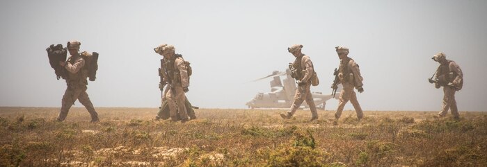 U.S. Marines assigned to the Special Purpose Marine Air-Ground Task Force-Crisis Response-Central Command (SPMAGTF-CR-CC) 19.2, load onto an MV-22 Osprey during a tactical recovery of aircraft and personnel (TRAP) exercise on Karan Island, Kingdom of Saudi Arabia, April 23, 2020. The exercise affords the SPMAGTF an opportunity to sustain its critical mission capabilities, demonstrate its ability to rapidly respond to emergent threats and crises, and improve its ability to project power in the maritime domain. (U.S. Marine Corps photo by Sgt. Kyle C. Talbot)