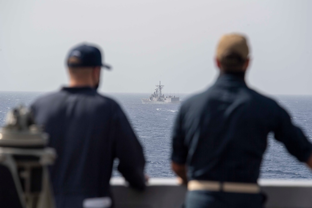 210314-N-JC800-1058 RED SEA (March 14, 2021) - U.S. Navy Sailors observe Egyptian guided-missile frigate ENS Sharm El Sheikh (FFG 901) from the bridge wing of amphibious transport dock ship USS Somerset (LPD 25) during a passing exercise in the Red Sea, March 14. Somerset, part of the Makin island Amphibious Ready Group, and the 15th Marine Expeditionary Unit are deployed to the U.S. 5th Fleet area of operations in support of naval operations to ensure maritime stability and security in the Central Region, connecting the Mediterranean and Pacific through the western Indian Ocean and three strategic choke points. (U.S. Navy photo by Mass Communication Specialist 2nd Class Heath Zeigler)