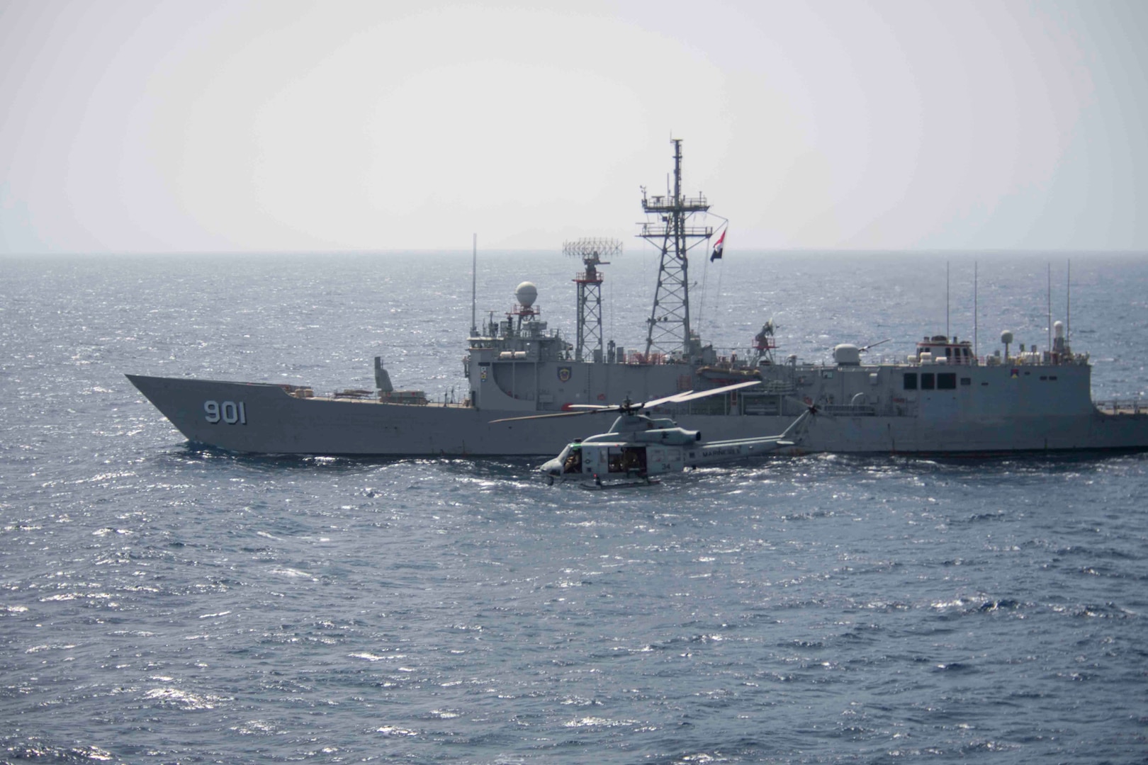 210314-N-JC800-1400 RED SEA (March 14, 2021) – U.S. Navy Capt. Dave Kurtz, commanding officer of amphibious transport dock ship USS Somerset (LPD 25), observes Egyptian guided-missile frigate ENS Sharm El Sheikh (FFG 901) during a passing exercise in the Red Sea, March 14. Somerset, part of the Makin island Amphibious Ready Group, and the 15th Marine Expeditionary Unit are deployed to the U.S. 5th Fleet area of operations in support of naval operations to ensure maritime stability and security in the Central Region, connecting the Mediterranean and Pacific through the western Indian Ocean and three strategic choke points. (U.S. Navy photo by Mass Communication Specialist 2nd Class Heath Zeigler)