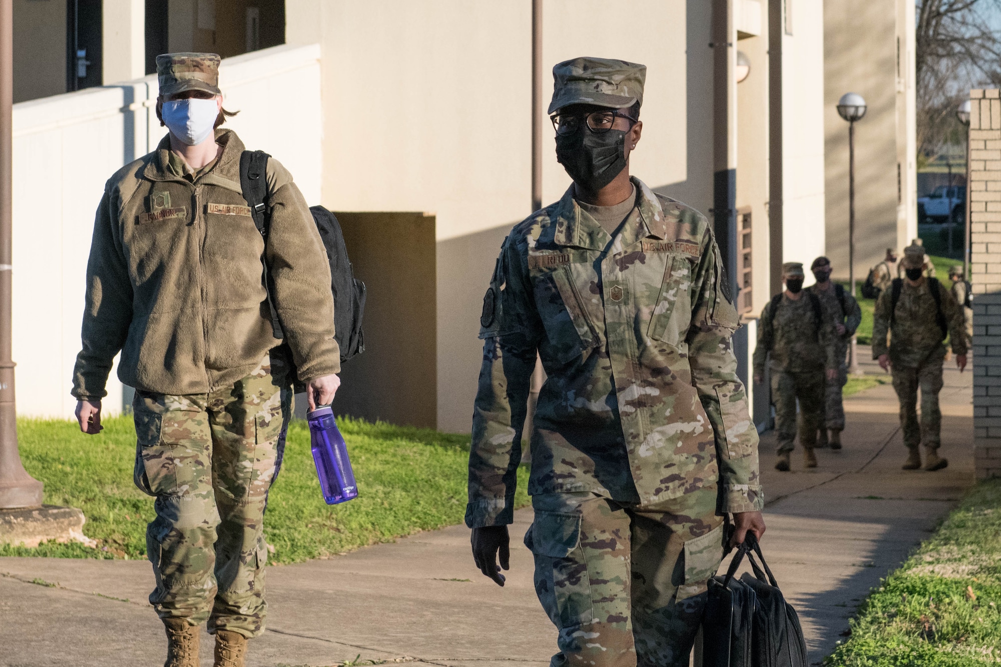 Senior Noncommissioned Officer Academy students walk to class March 4, 2021, on Maxwell Air Force Base's Gunter Annex. After nearly a year of only virtual classes, SNCOA welcomed back its first in-residence class this month. (U.S. Air Force photo by Airman 1st Class Cody Gandy)