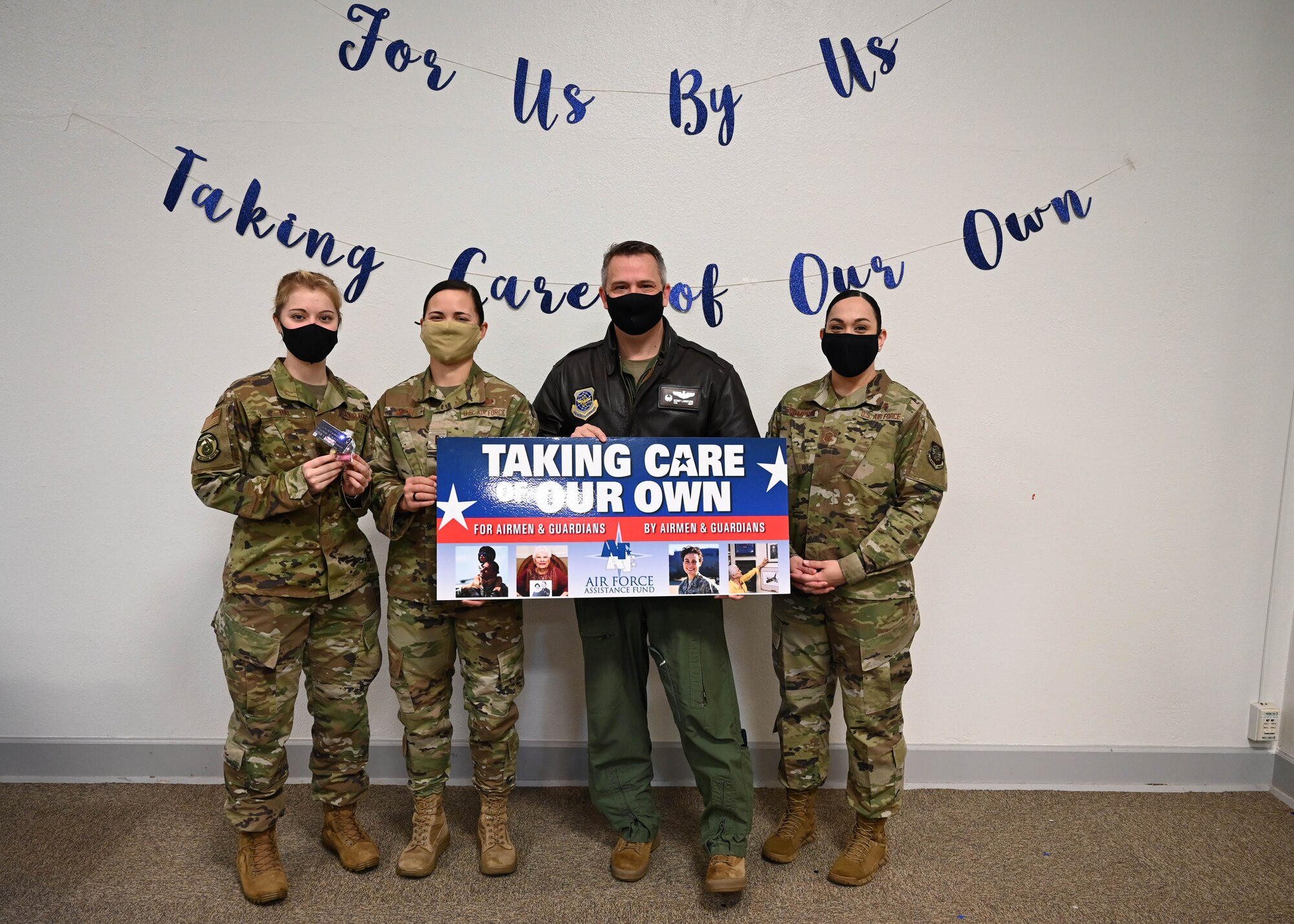 U.S. Air Force Col. Robert Lankford, 62nd Operations Group commander, poses with project officers for the Air Force Assistance Fund at Joint Base Lewis-McChord, Washington, March 15, 2021. Lankford was the first donor for this year’s campaign. (U.S. Air Force photo by Tech. Sgt. Joshua Smoot)