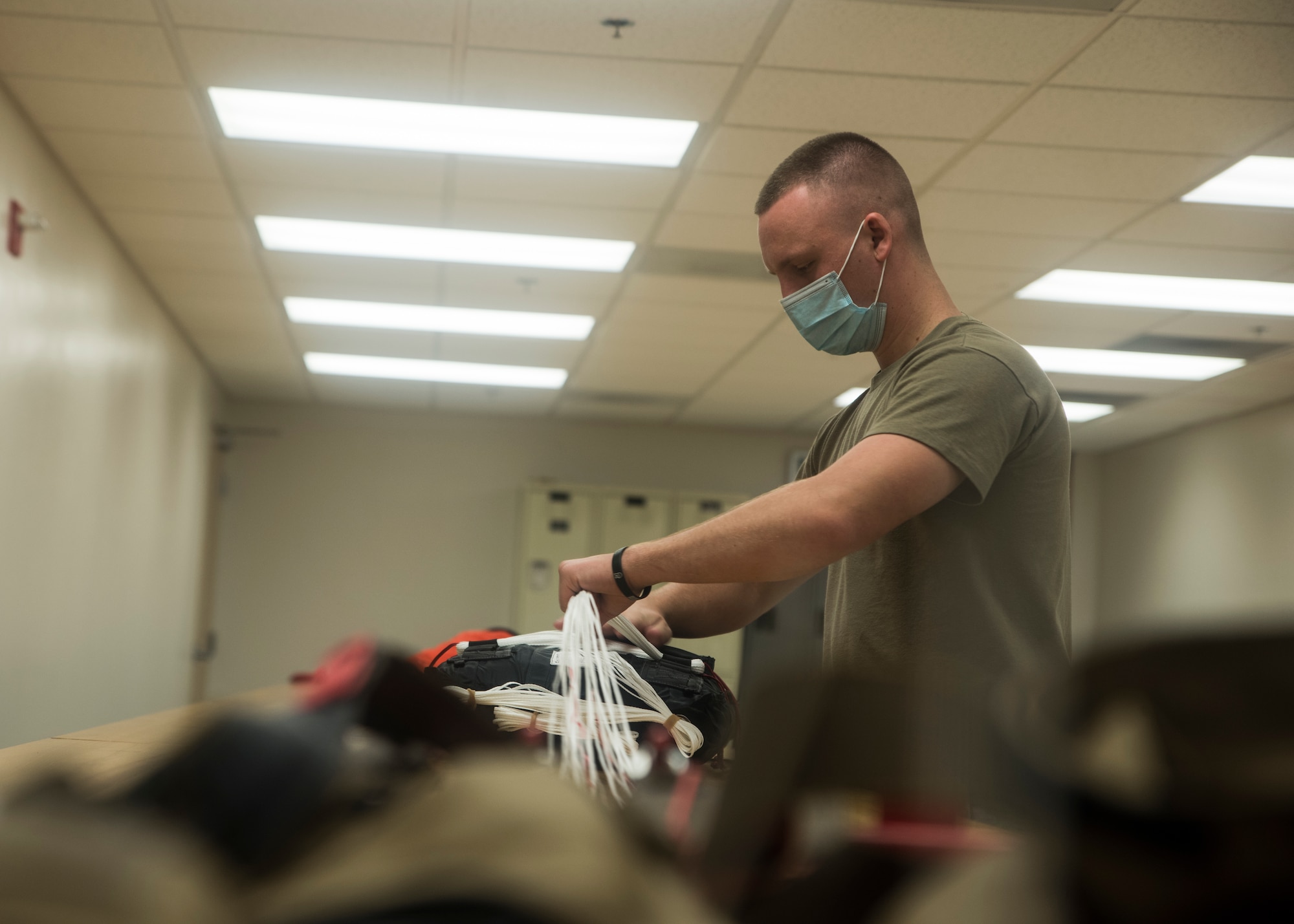 A photo of an Airman working on equipment