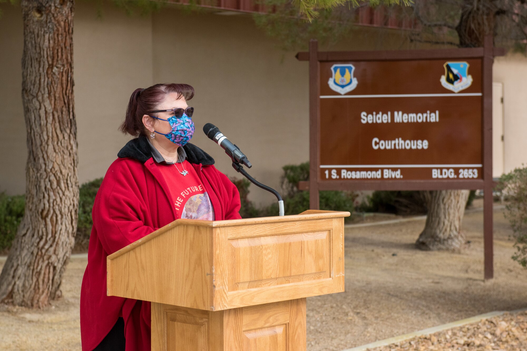 Courtesy Photo | Nadine Seidel, wife of the late Warren Seidel, gives remarks at the renaming ceremony of the “Seidel Memorial Courthouse” at Edwards Air Force Base, California, March 18. The courthouse is named after her husband, Warren Seidel, who passed away last year following a short battle with cancer, he had served at Edwards for almost 25 years. (Air Force photo by Richard Gonzales
