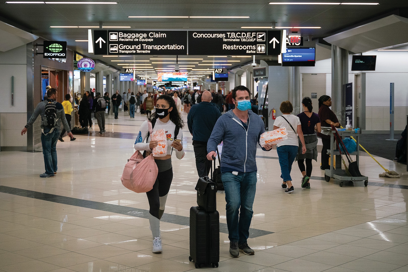 Flyers at Hartsfield-Jackson Atlanta International Airport wearing facemasks on March 6th, 2020 as the COVID-19 coronavirus spreads throughout the United States. (Chad Davis, March 6, 2020)