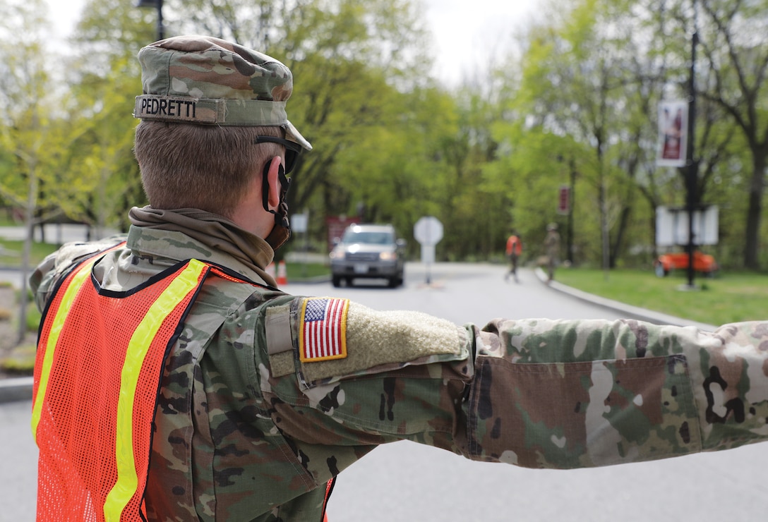 Soldiers from the Rhode Island National Guard perform multiple tasks at a COVID-19 test site located at Rhode Island College, North Providence, RI. (Rhode Island National Guard, May 6, 2020)