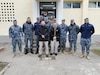 Photo of Tobyhanna Army Depot Training Instructors Gregory Wirth (left) and Vincent Zuranski (right) pose with students during a recent mission to train Romanian Air Force personnel.