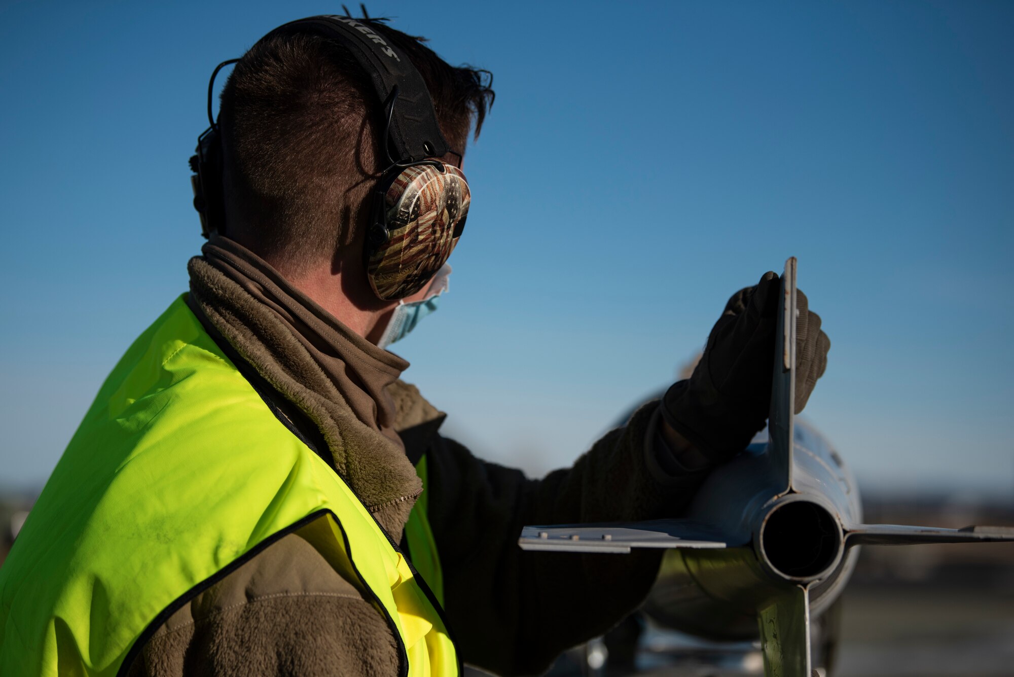 A weapons load crew team chief assigned to the 9th Expeditionary Bomb Squadron prepares a bomb dummy unit to be transported to a B-1B Lancer at Ørland Air Force Station, Norway, March 13, 2021. Bomber weapon system officers generally use BDU munitions while conducting routine combat training missions. (U.S. Air Force photo by Airman 1st Class Colin Hollowell)