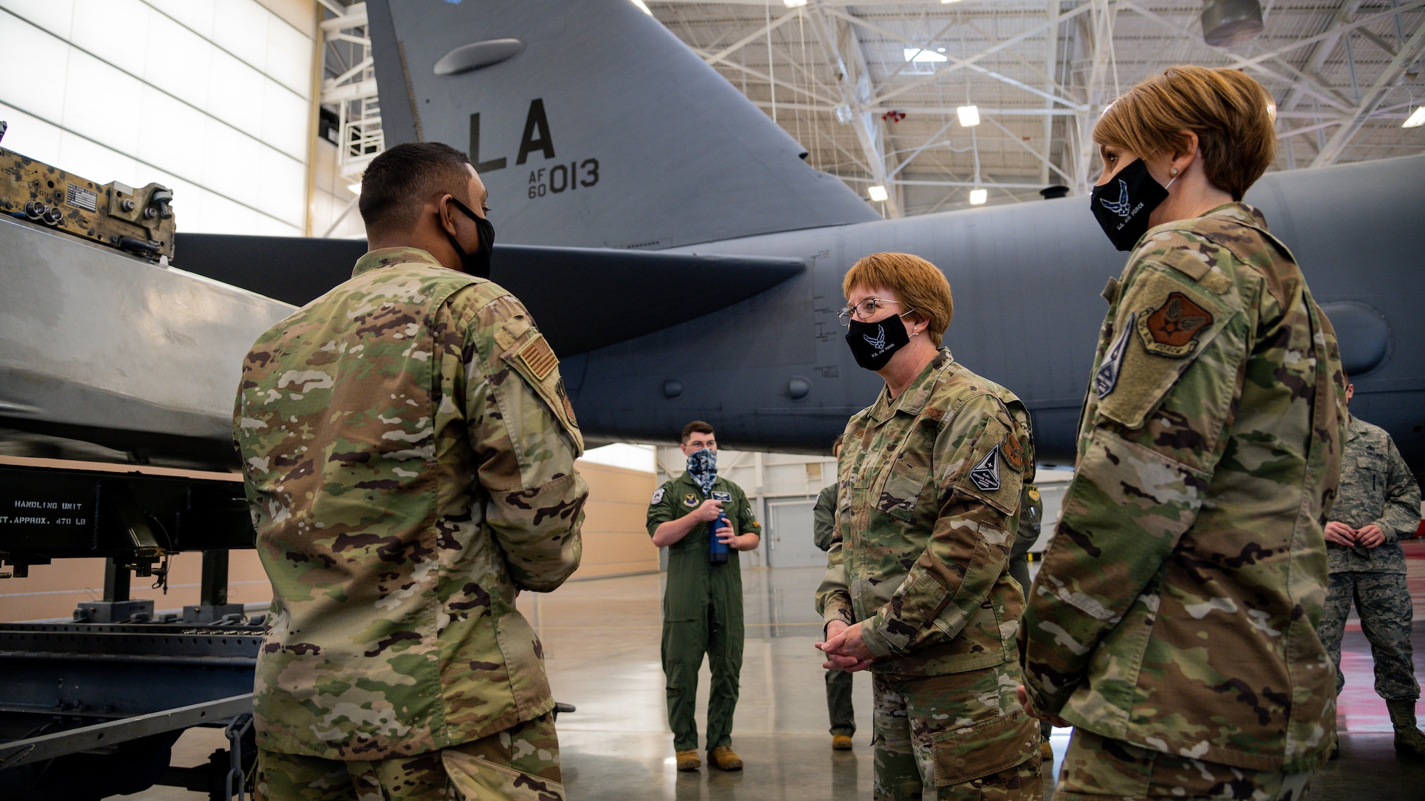 Lt. Gen. Dorothy Hogg, U.S. Air Force Surgeon General, middle, and Chief Master Sgt. Dawn Kolczynski, Office of the Surgeon General medical enlisted force and enlisted corps chief, right, visit the 2nd Maintenance Group and speak with Airmen about their jobs and how they have handled the COVID-19 pandemic at Barksdale Air Force Base, Louisiana, March 10, 2021.