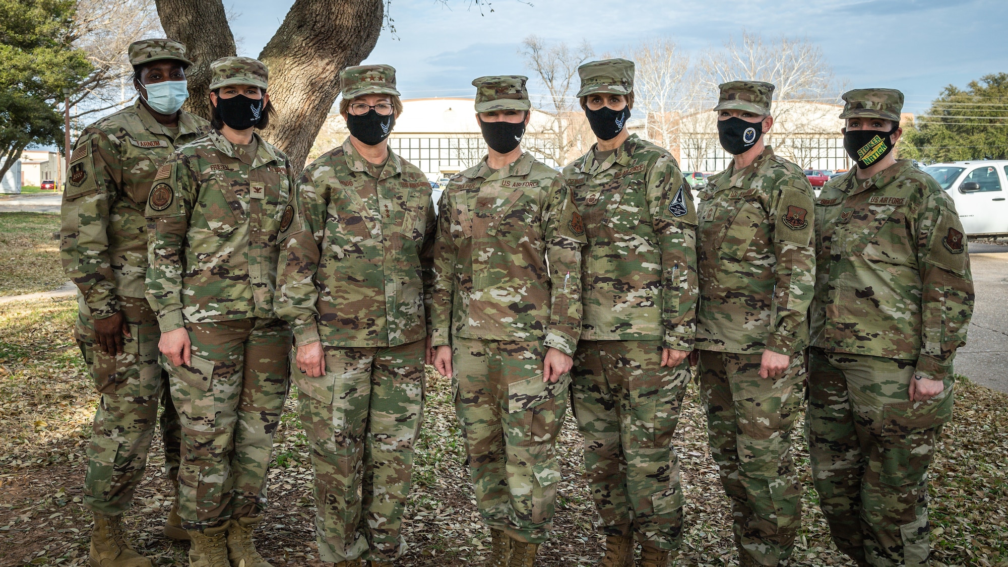 Lt. Gen. Dorothy Hogg, U.S. Air Force Surgeon General, middle left, and Chief Master Sgt. Dawn Kolczynski, Office of the Surgeon General medical enlisted force and enlisted corps chief, pose for a photo with female leadership from Barksdale Air Force Base, Louisiana, March 10, 2021.