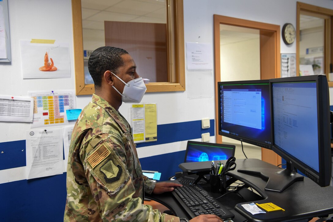An Airman working at a computer