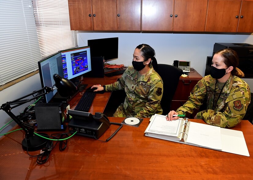 From left, Maj. Kristin Selvidge, 625th Strategic Operations Squadron planner, and Capt. Brittany Baver, 625 STOS planner, conduct targeting procedures for intercontinental ballistic missiles March 5, 2021, at Offutt Air Force Base, Neb.