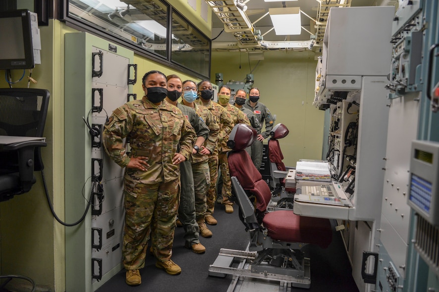 Women missileers from the 740th Missile Squadron pose for a photo in the 91 Operations Support Squadron missile procedure trainer on March 8, 2021, at Minot Air Force Base, North Dakota.