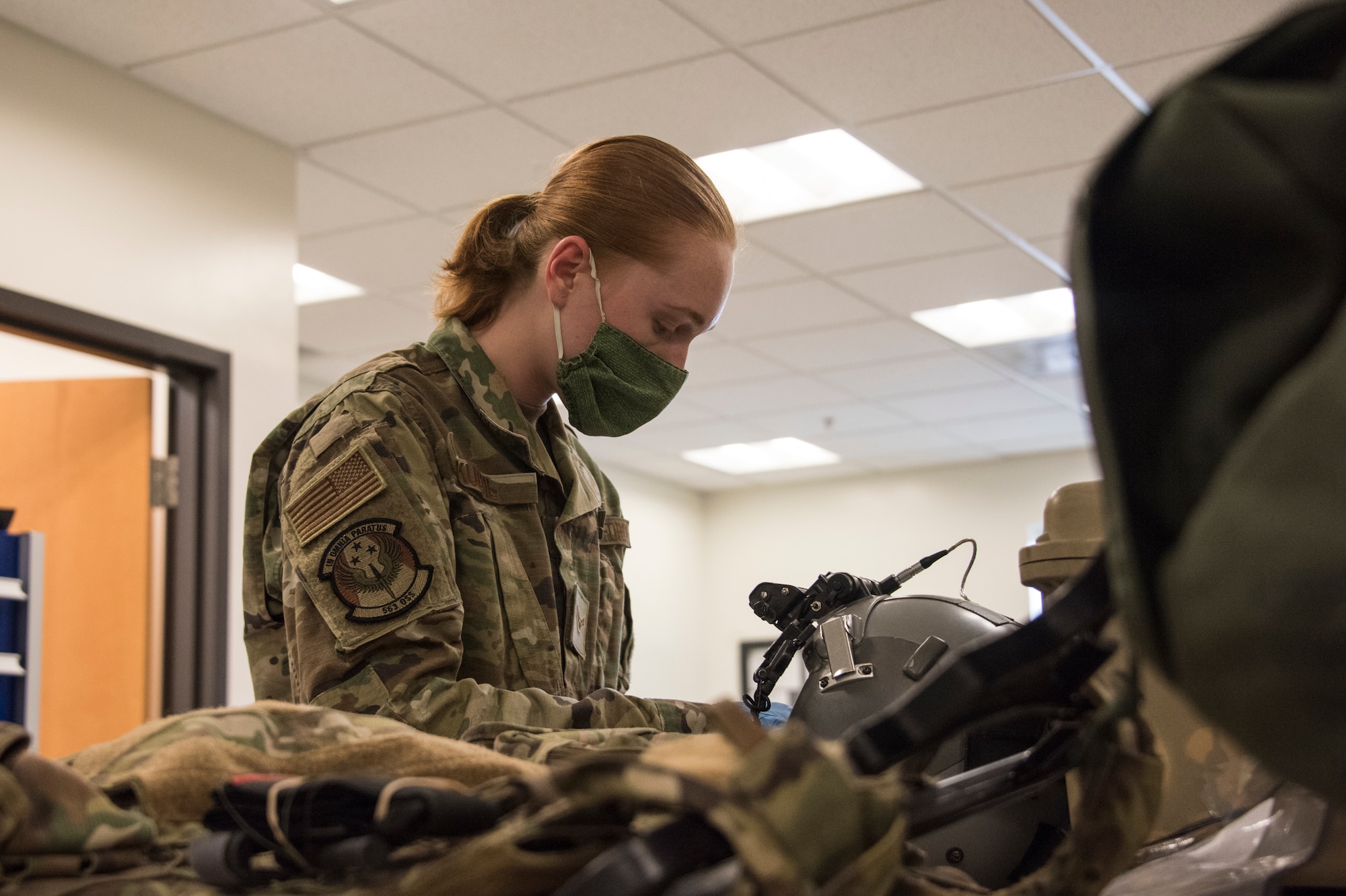 A photo of an Airman working on equipment