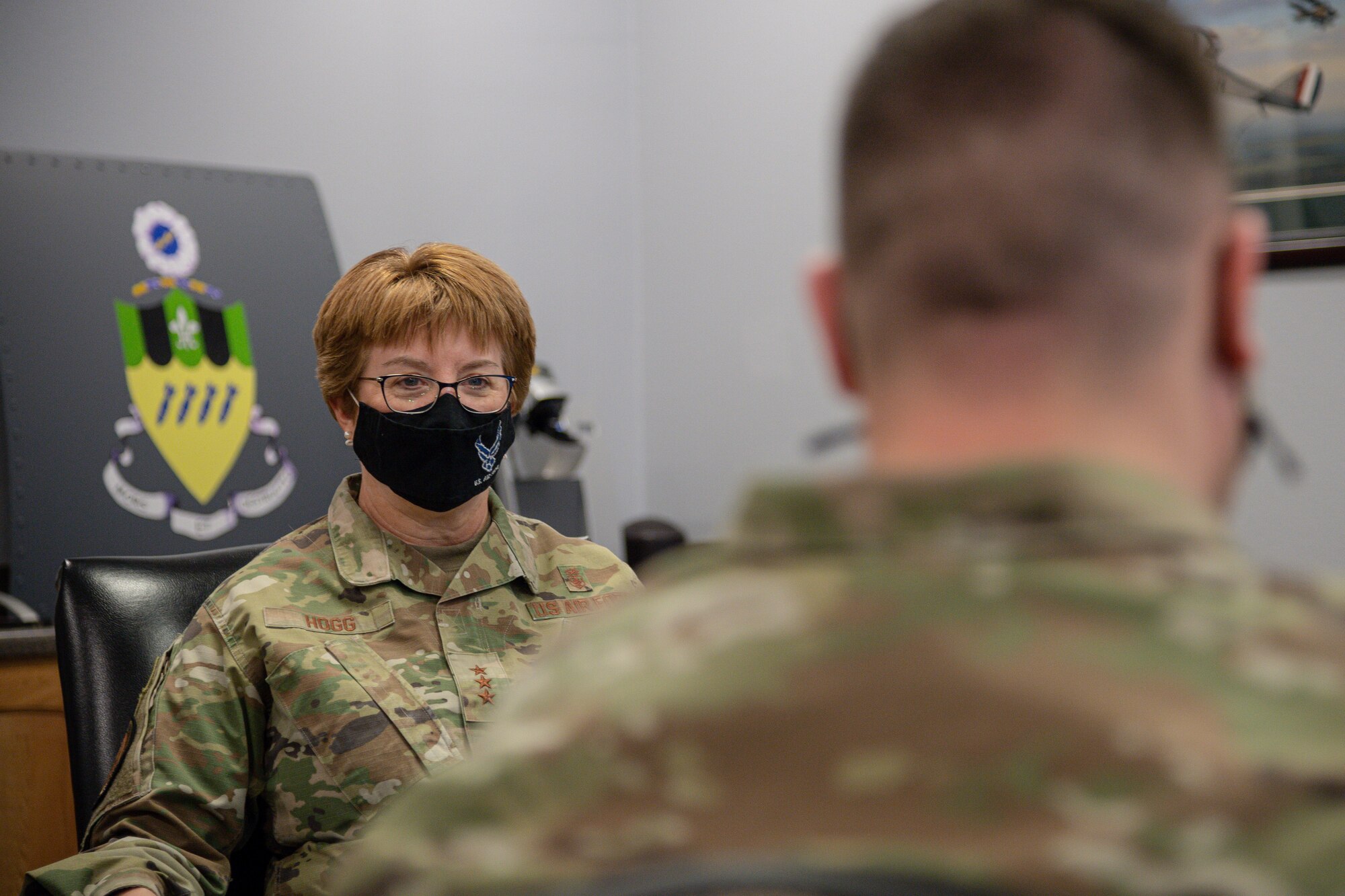 Lt. Gen. Dorothy Hogg, U.S. Air Force surgeon general, speaks with Col. Mark Dmytryszyn, 2nd Bomb Wing commander, before a Barksdale’s Best presentation at Barksdale Air Force Base, Louisiana, March 10, 2021.