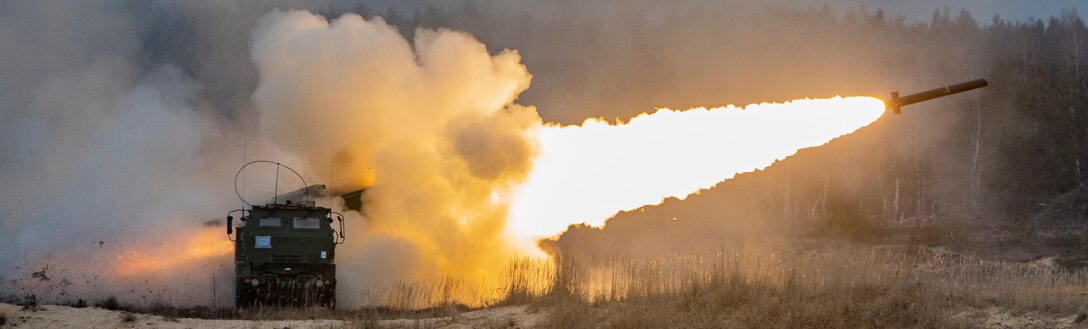 U.S. Marines with Fox Battery, 2nd Battalion, 14th Marine Regiment, 4th Marine Division, launch rockets from a High Mobility Artillery Rocket System during live-fire training at Adazi Training Area, Latvia, March 7, 2019