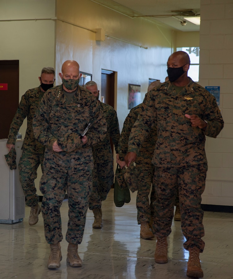 U.S. Marine Corps Gen. David H. Berger, the 38th Commandant of the Marine Corps speaks with Col. Henry Dolberry Jr., commanding officer, Marine Corps Air Station (MCAS) Futenma at MCAS Futenma, Okinawa, Japan, Nov. 16, 2020. The Okinawa-based III MEF is the only forward deployed MEF, and its thousands of Marines and sailors stand ready to support contingency operations, crisis response, and theater security cooperation events. The unit seeks to strengthen allies and partners to promote a free and open Indo-Pacific. (U.S. Marine Corps photo by Lance Cpl. Alex Fairchild)