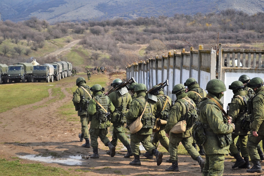 Russian soldiers marching on March 5, 2014 in Perevalne, Crimea, Ukraine. On February 28, 2014 Russian military forces invaded Crimea peninsula. (photo.ua from Shutterstock, March 5, 2014)