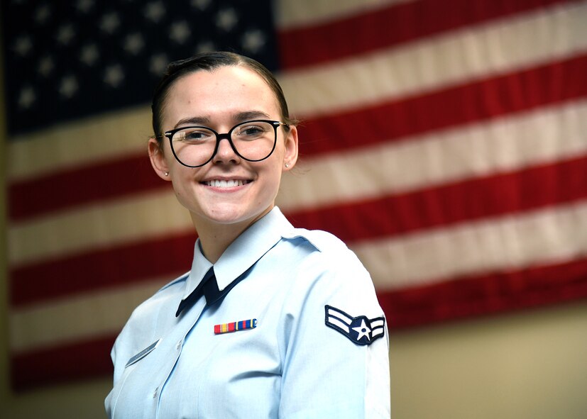 Airman 1st Class Kayla Stevens, 66th Air Base Group Office of the Staff Judge Advocate paralegal, poses for a photo in the Legal office at Hanscom Air Force Base, Mass., March 18, after winning the 2020 Air Force Materiel Command Olan G. Waldrop, Jr. Unsung Hero Award. The 66 ABG JA office is also home to the AFMC Outstanding Legal Office and Civilian Attorney of the Year, Rachel D'Orazio, all of whom will go on to compete at the Air Force-level. (U.S. Air Force photo by Linda LaBonte Britt)